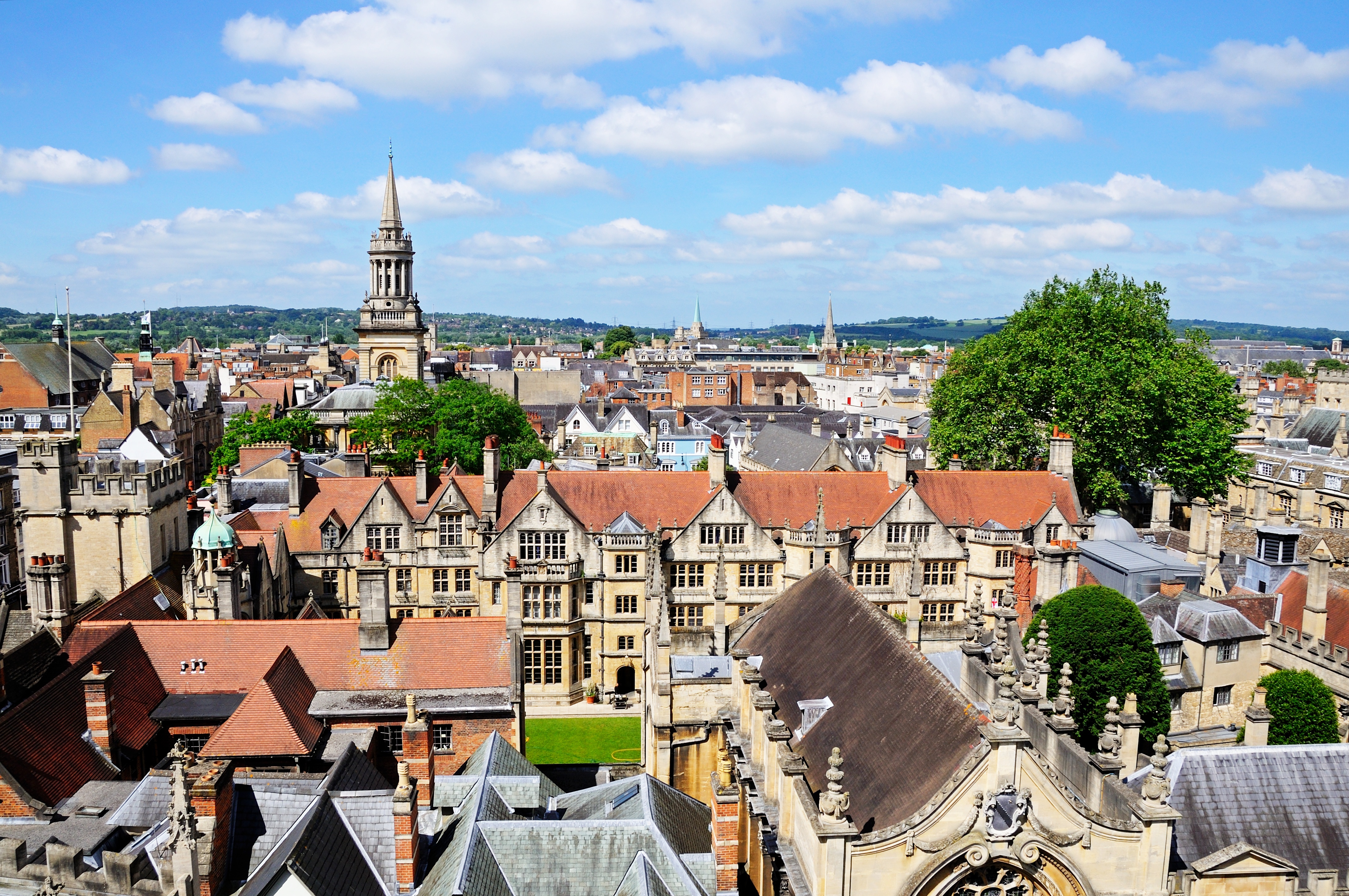 View over the city rooftops from the University church of St Mary spire, Oxford, Oxfordshire, England, UK, Western Europe.